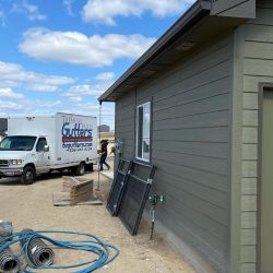 Side of garage with Treasure Valley Gutters Truck in back ground